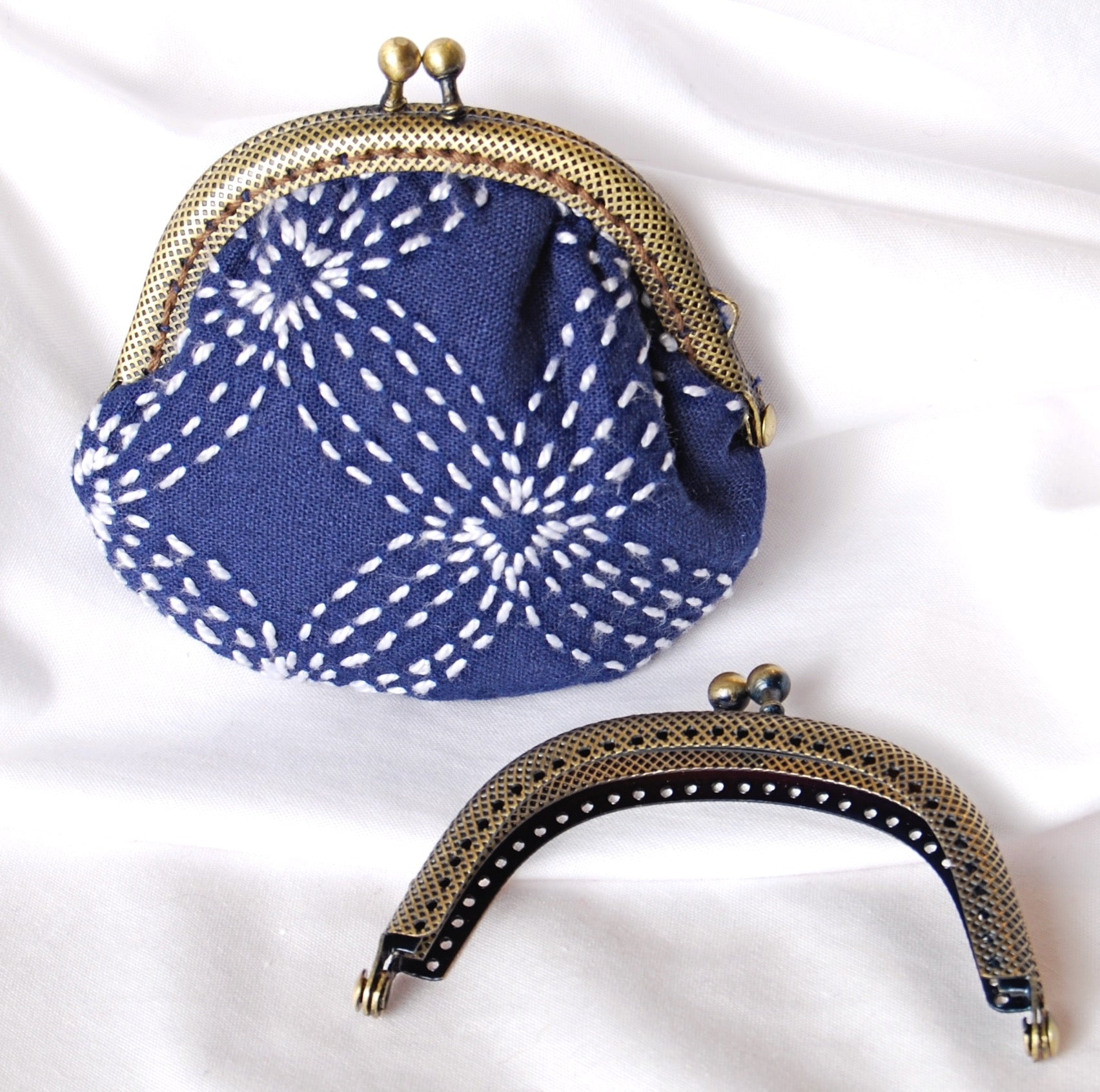 Clasp purse with sashiko stitching