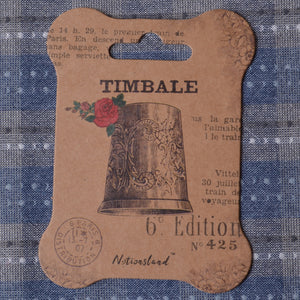 thread winder with antique thimble