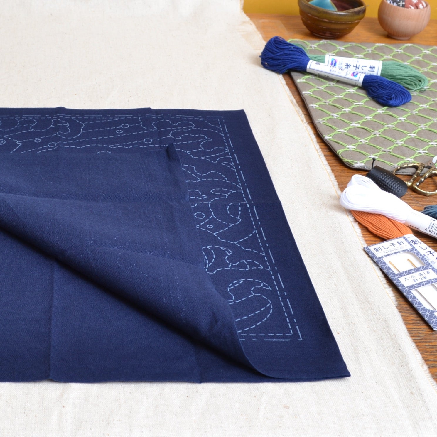 Showing both sides of a sashiko cloth, pre printed 