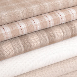 bolts of taupe sewing fabrics