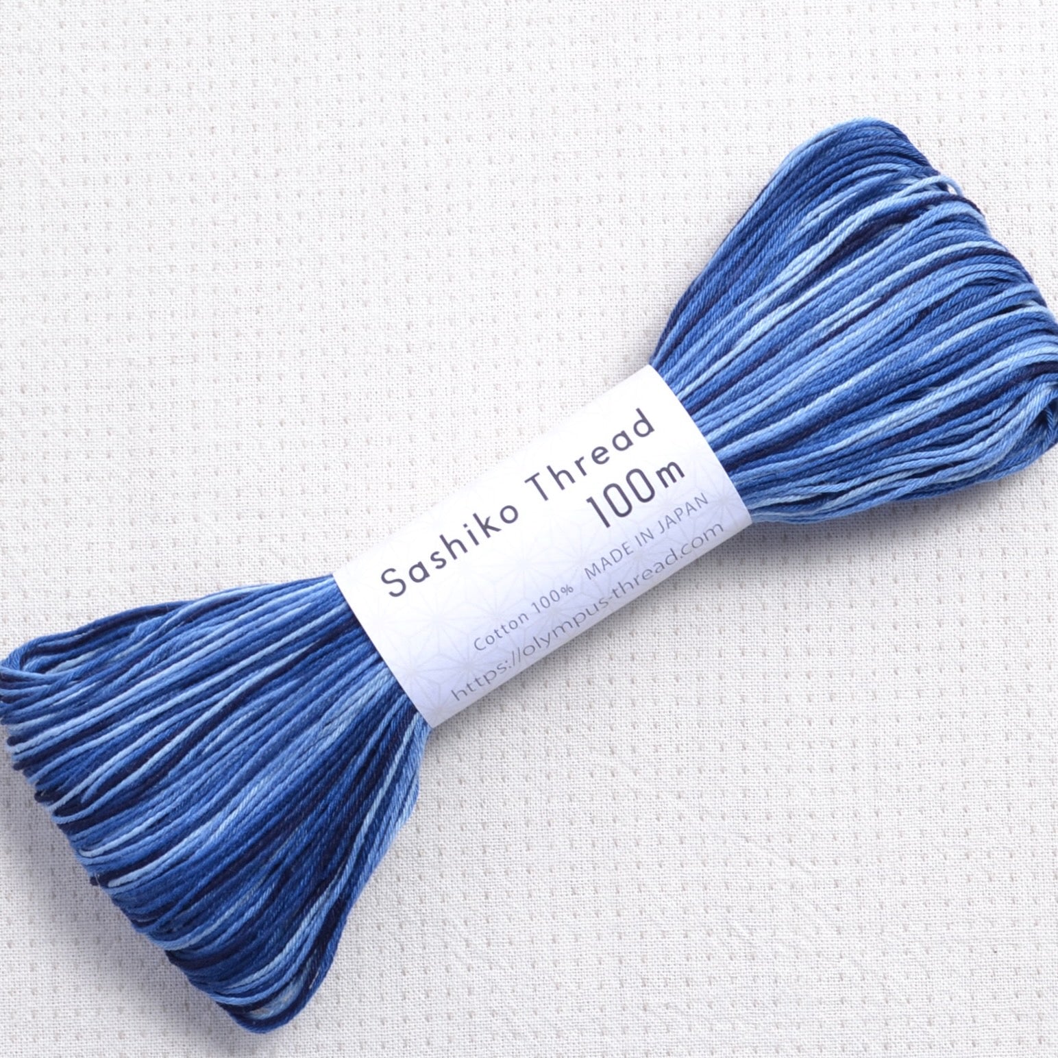 Olympus sashiko thread, 100 meter skein, variegated blues #157