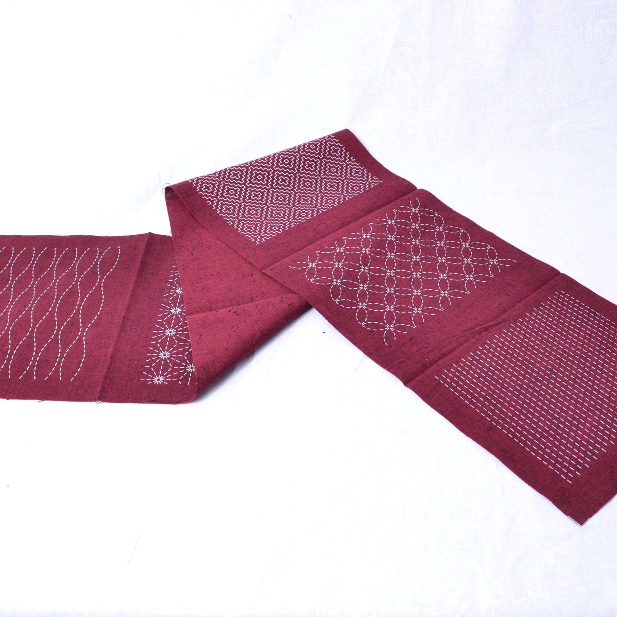 Red tsumugi cotton fabric with sashiko pre printed designs
